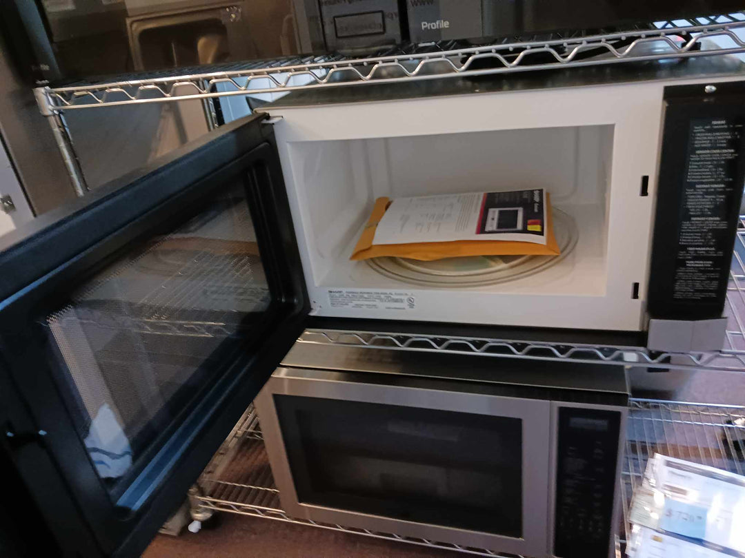 Sharp R1214TY 1.5 cu. ft. Over the Counter Microwave in Stainless Steel with Sensor Cooking Technology *DISPLAY MODEL