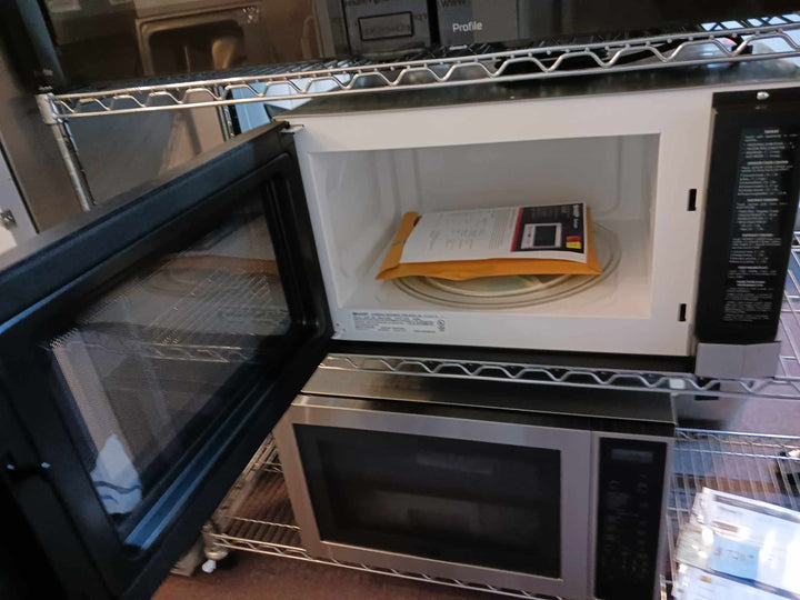 Sharp R1214TY 1.5 cu. ft. Over the Counter Microwave in Stainless Steel with Sensor Cooking Technology *DISPLAY MODEL