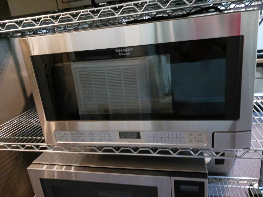 Sharp R1214TY 1.5 cu. ft. Over the Counter Microwave in Stainless Steel with Sensor Cooking Technology *DISPLAY MODEL